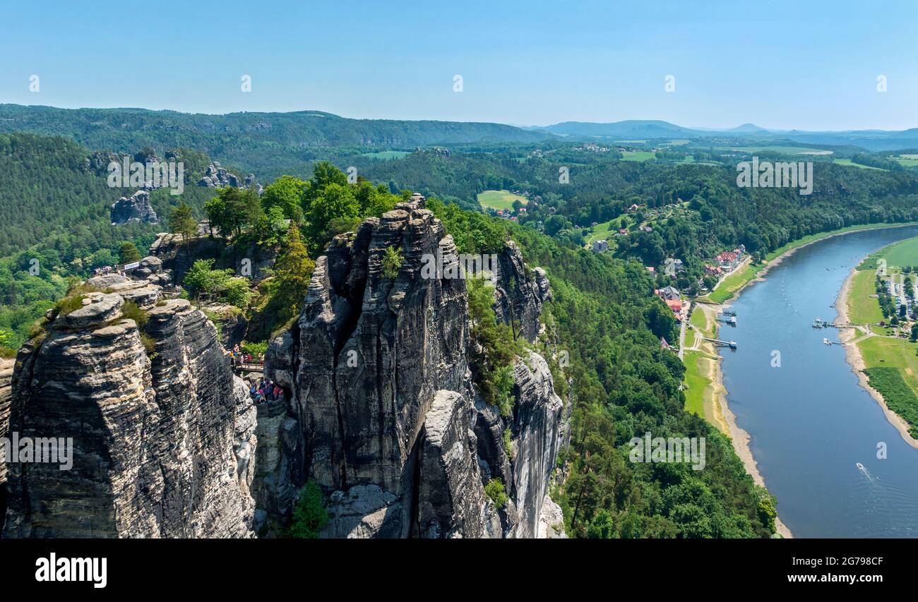 The Bastei is a rock formation with a viewing platform in Saxon Switzerland on the right bank of the Elbe in the area of the municipality of Lohmen. It is one of the most popular tourist attractions in Saxon Switzerland. View from the bastion Stock Photo
