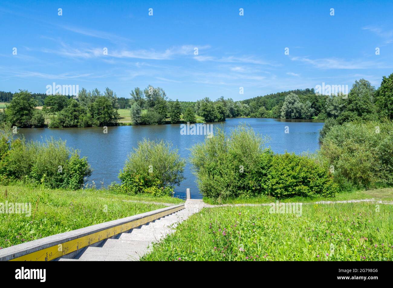 Germany, Baden-Wuerttemberg, Welzheim-Aichstrut, Aichstrut flood retention basin, Aichstruter reservoir, bathing area with sunbathing area. Excursion destination, local recreation area in the Welzheimer Forest in the Swabian-Franconian Forest Nature Park. Stock Photo
