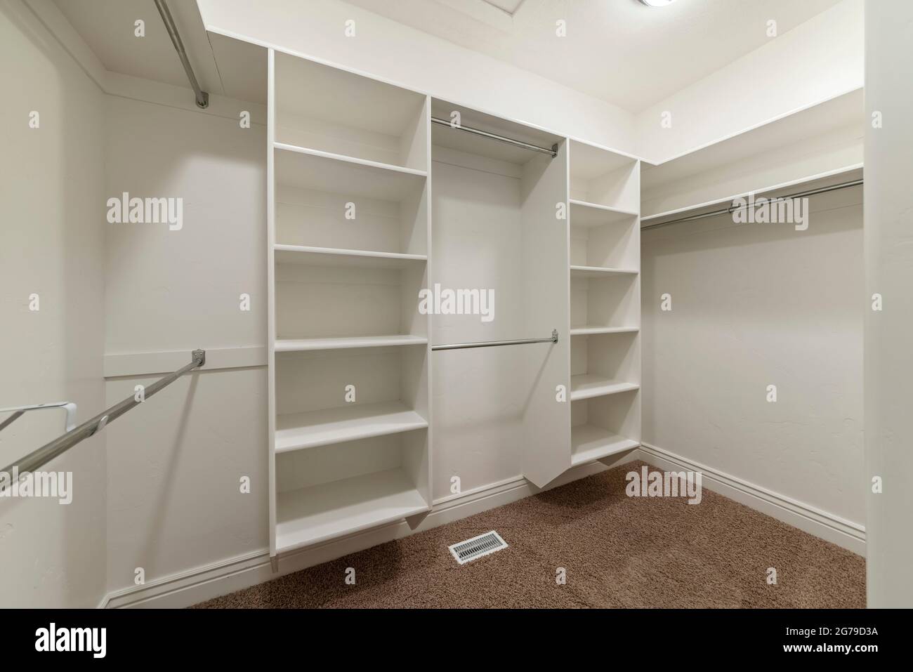 Interior of an empty walk-in closet room with floor vent Stock Photo