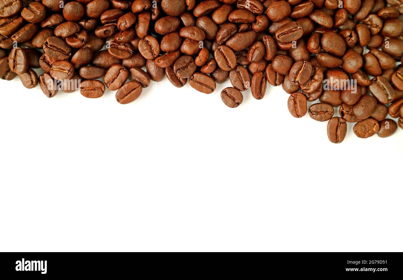 Heap of roasted coffee beans isolated on white background with copy ...