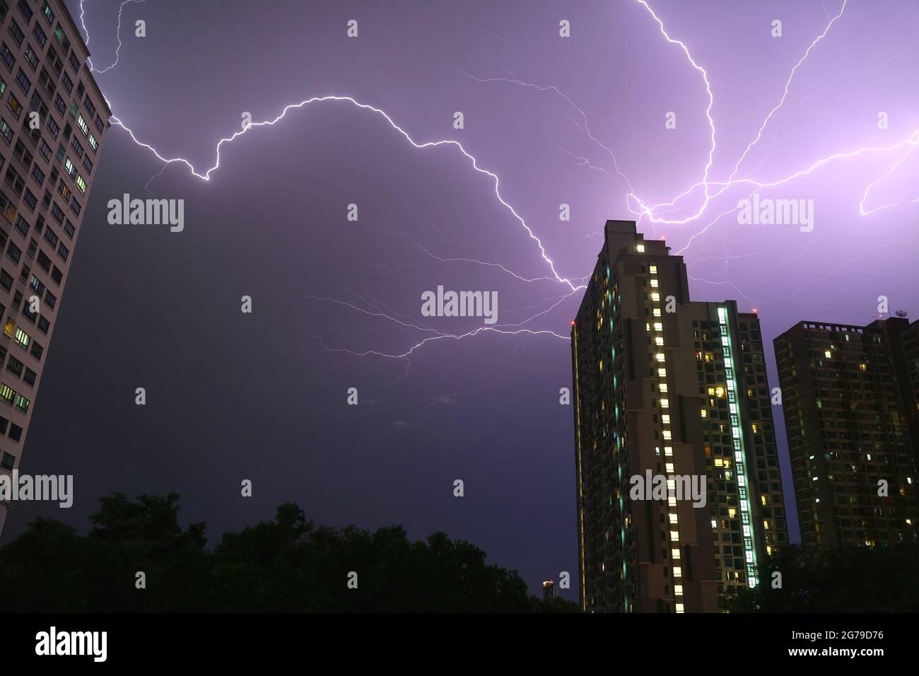 Incredible Real Lightning Strikes in the Urban Night Sky Stock Photo