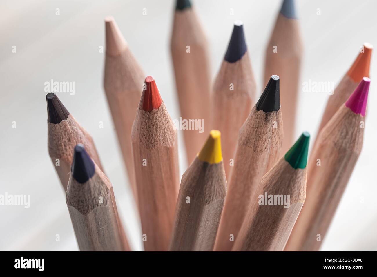Close up of colored pencils for drawing on blurred background Stock Photo