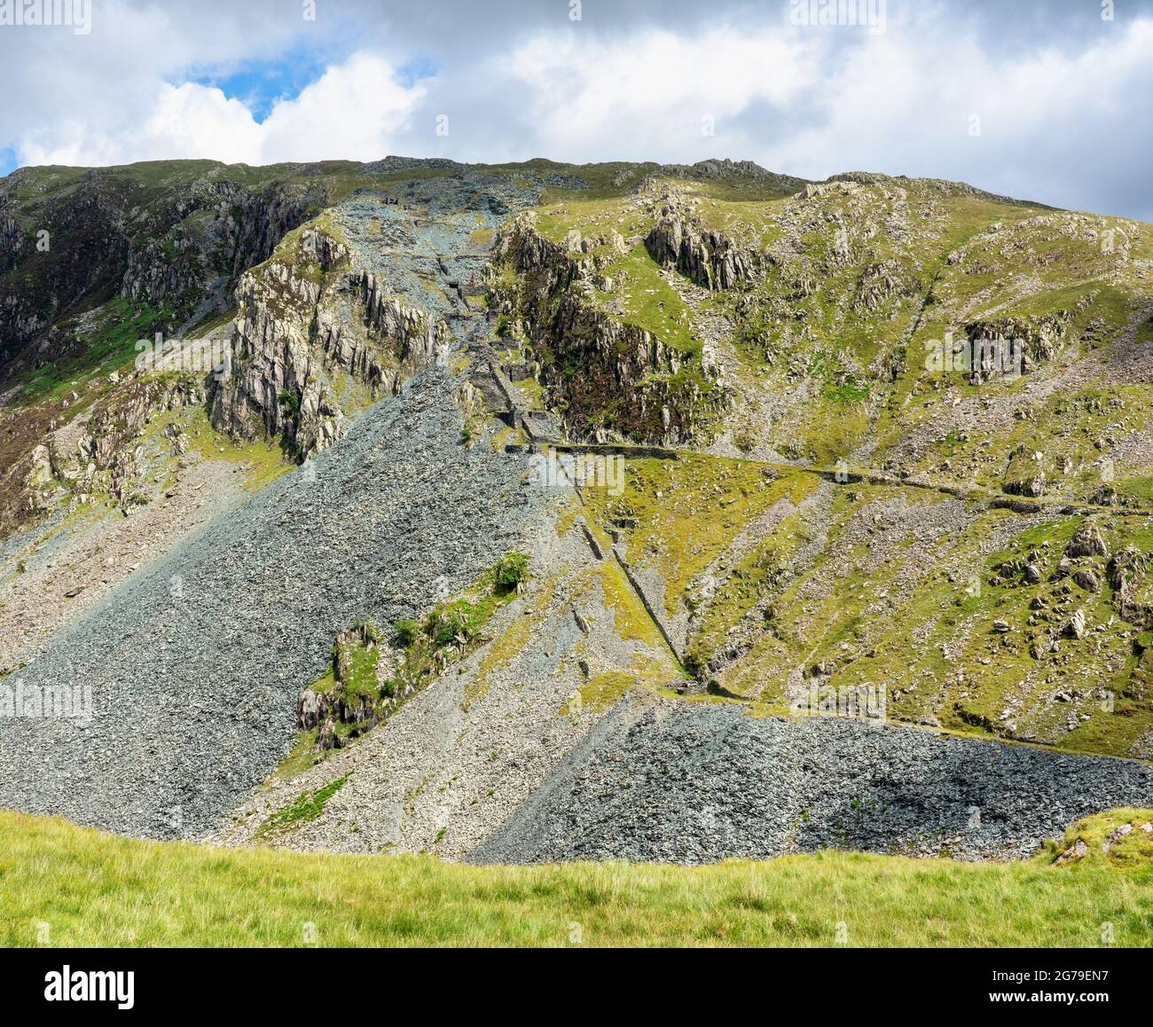 Abandoned slate mine workings ad disused tramways at the head of Honister Pass in the English Lake District Cumbria UK Stock Photo