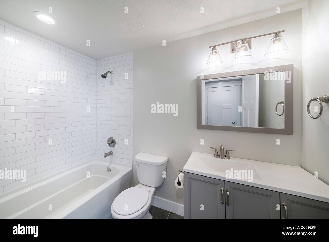 Interior of a bathroom with vanity sink and shower tub combo with