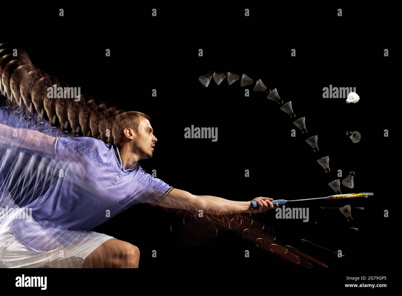 Spectacular trajectory of movement. One young male badminton player ...