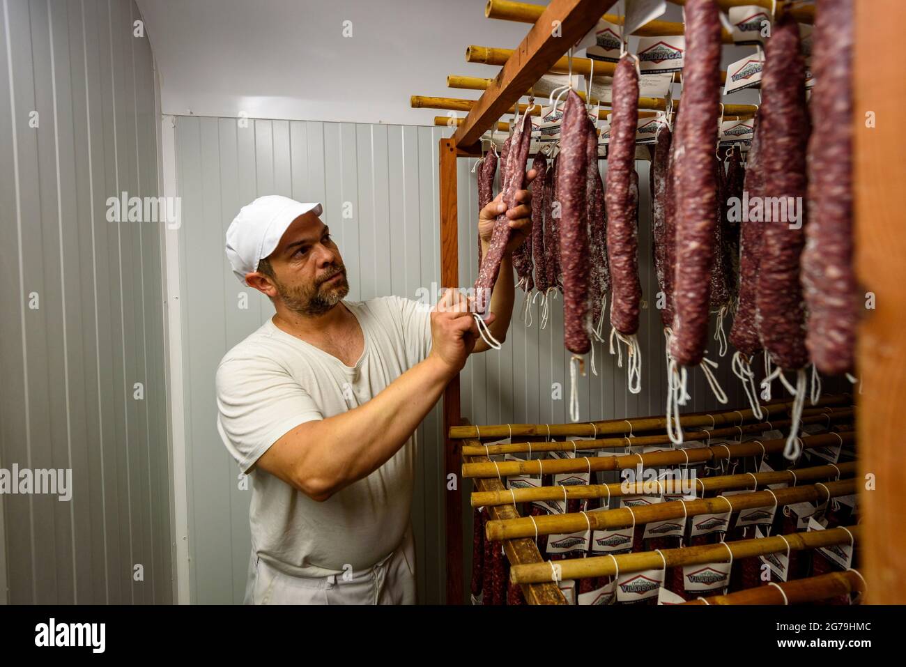 Catalan fuet dryer at the Embotits Vilardaga company in Alpens, Lluçanès, with Josep Vilardaga (Osona, Barcelona, Catalonia, Spain) Stock Photo