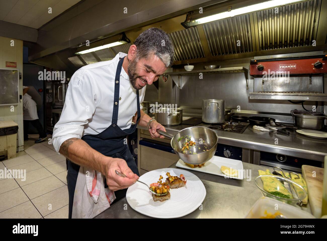 Chef Toni Sala and his team in the kitchen of the Fonda Sala. This restaurant was awarded with a Michelin star (Osona, Barcelona, Catalonia, Spain) Stock Photo