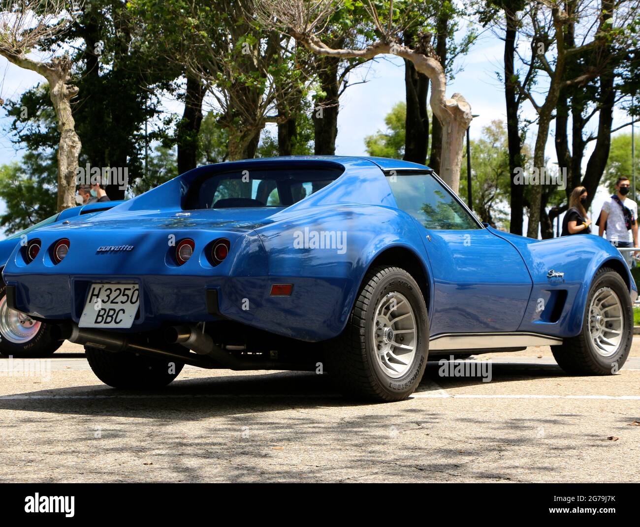 Rear view of a blue Chevrolet Corvette C3 Stingray car parked at a ...