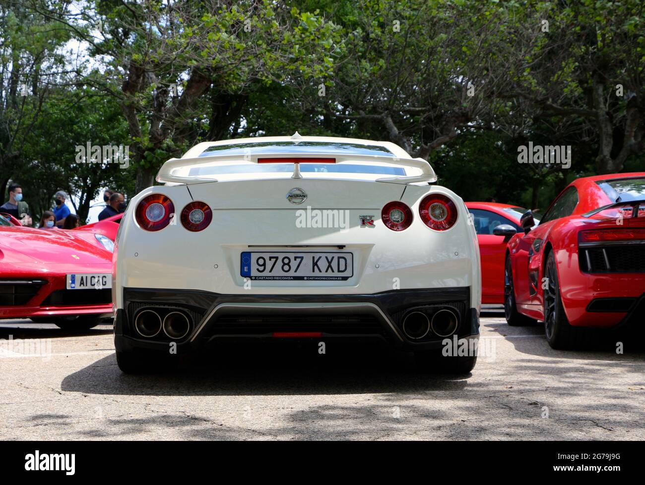 Rear view of a white Nissan Skyline GT-R car at a Super car day public ...