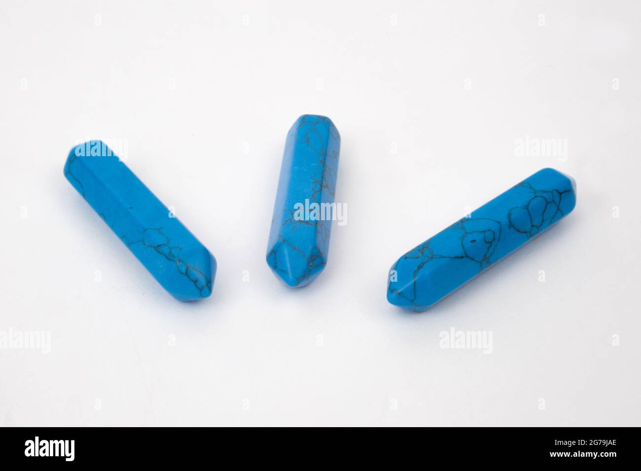 Blue Turquoise points, gemstones used for healing photographed against a white background Stock Photo