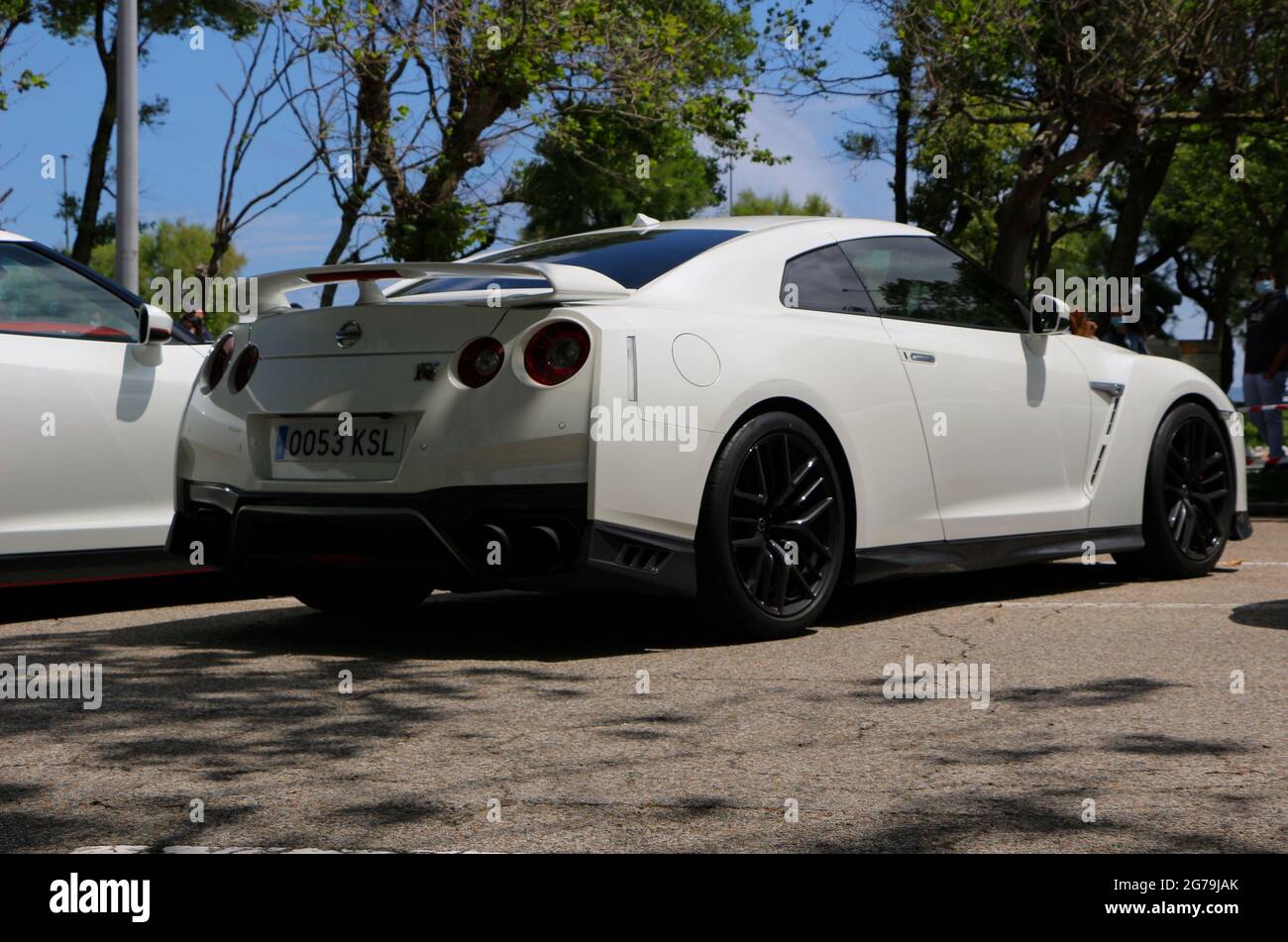 Rear view of a white Nissan Skyline GT-R car at a Super car day public ...