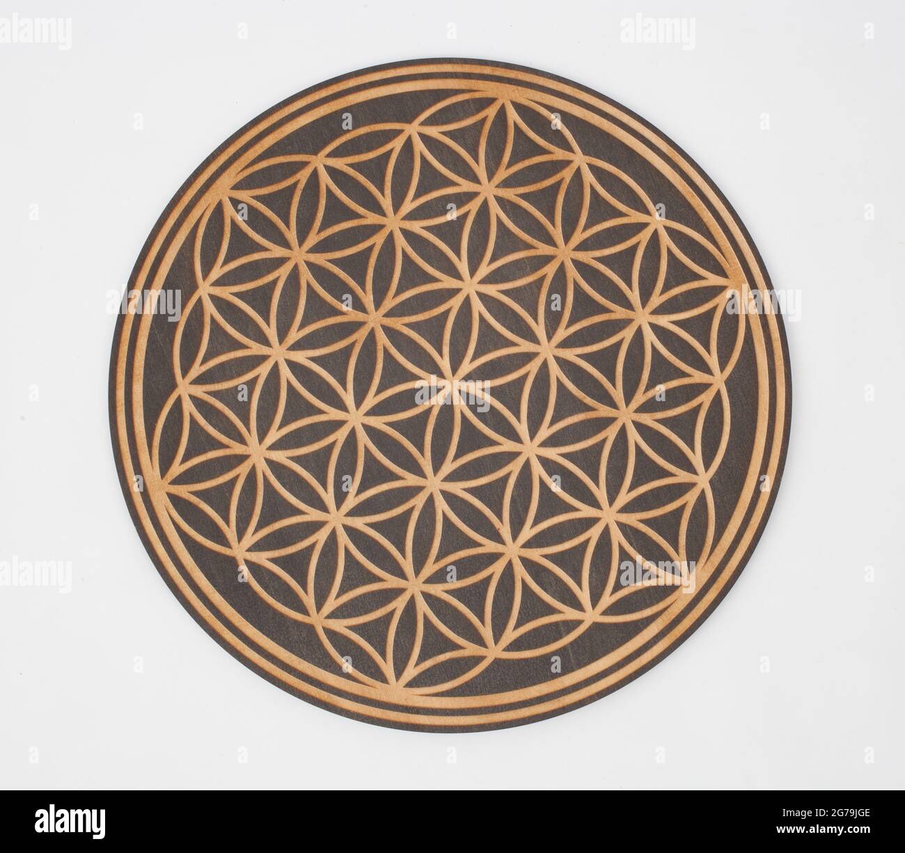 A wooden flower of life wooden board Stock Photo