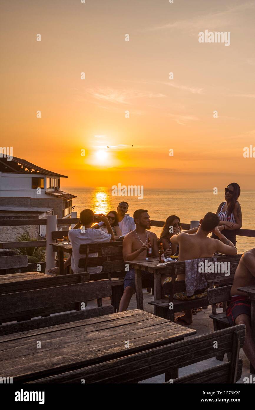 Enjoying the wonderful sunset at Prainha da Barra de Guaratiba from the Marambaia Roof Top Cafe rio Stock Photo
