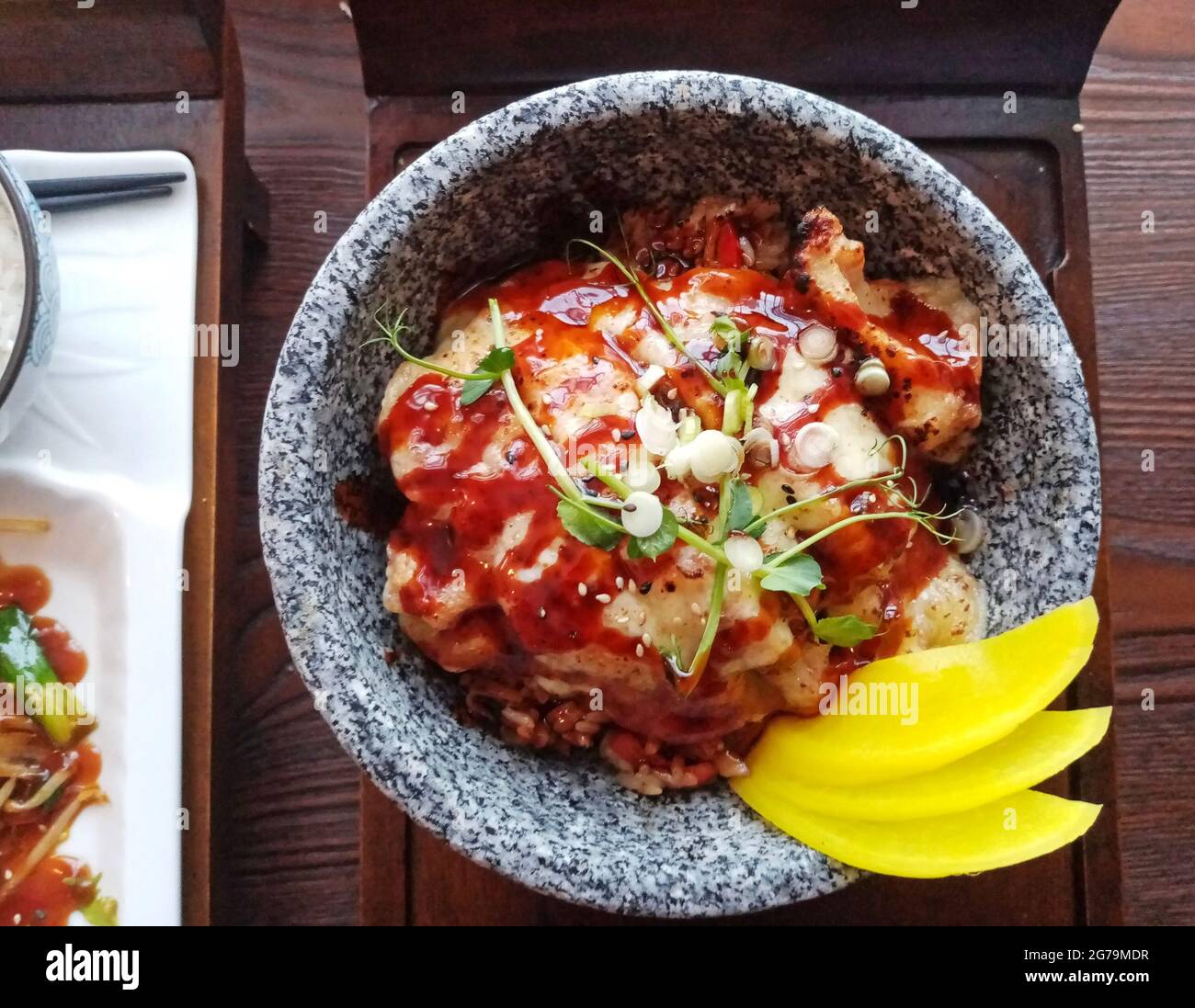Top view of Japanese tori cheese don, grilled chicken on bed of rice