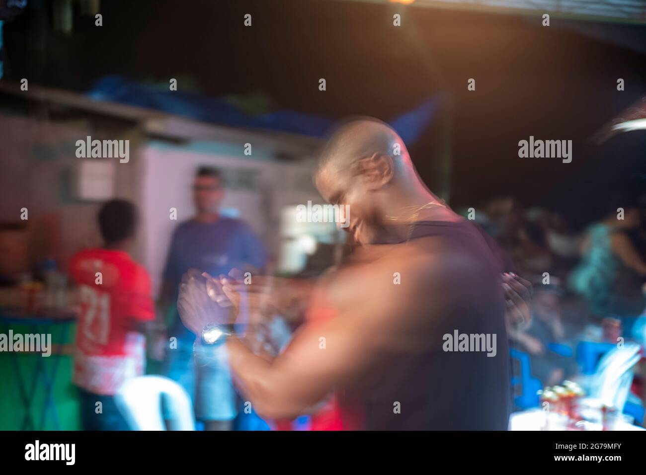 Party hard through the night with the locals - the Cariocas - in the favela 'Pereira da Silva' in Santa Teresa, Rio de Janeiro. Shot with Leica M10 Stock Photo