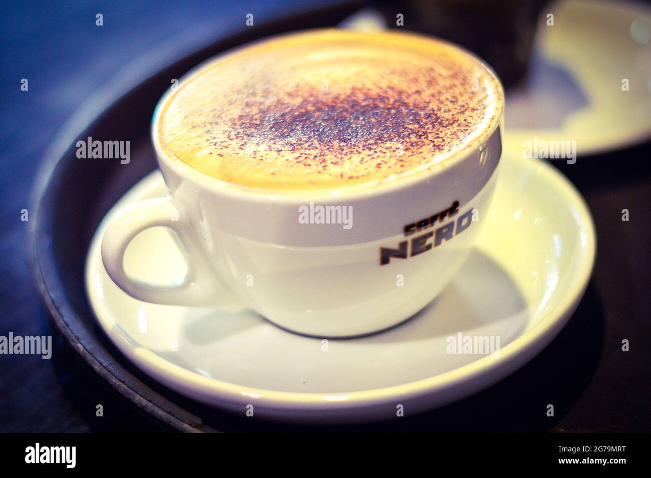 A Cup of Cappuccino on Table from Caffe Nero, Belfast, UK, Oct. 2016. Stock Photo