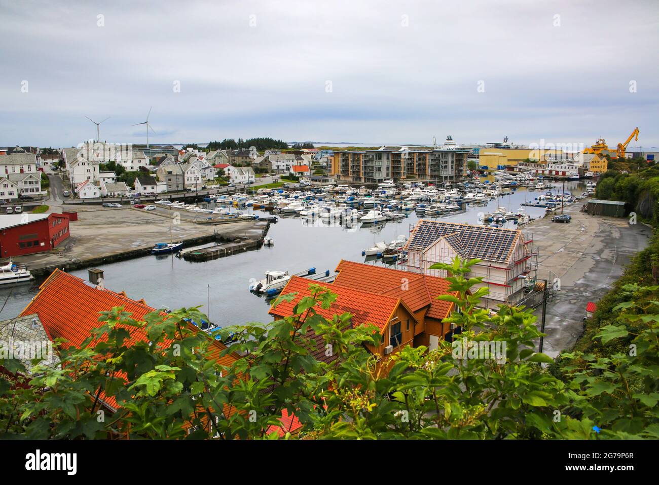 Smedasundet area and river in the center of the town. Surrounded by traditional buildings and boats in the water, Haugesund, Norway. Stock Photo