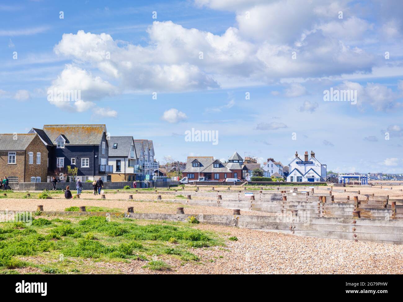 Whitstable sea front looking towards the Old Neptune pub groynes and shingle beach Whitstable Kent England UK GB Europe Stock Photo