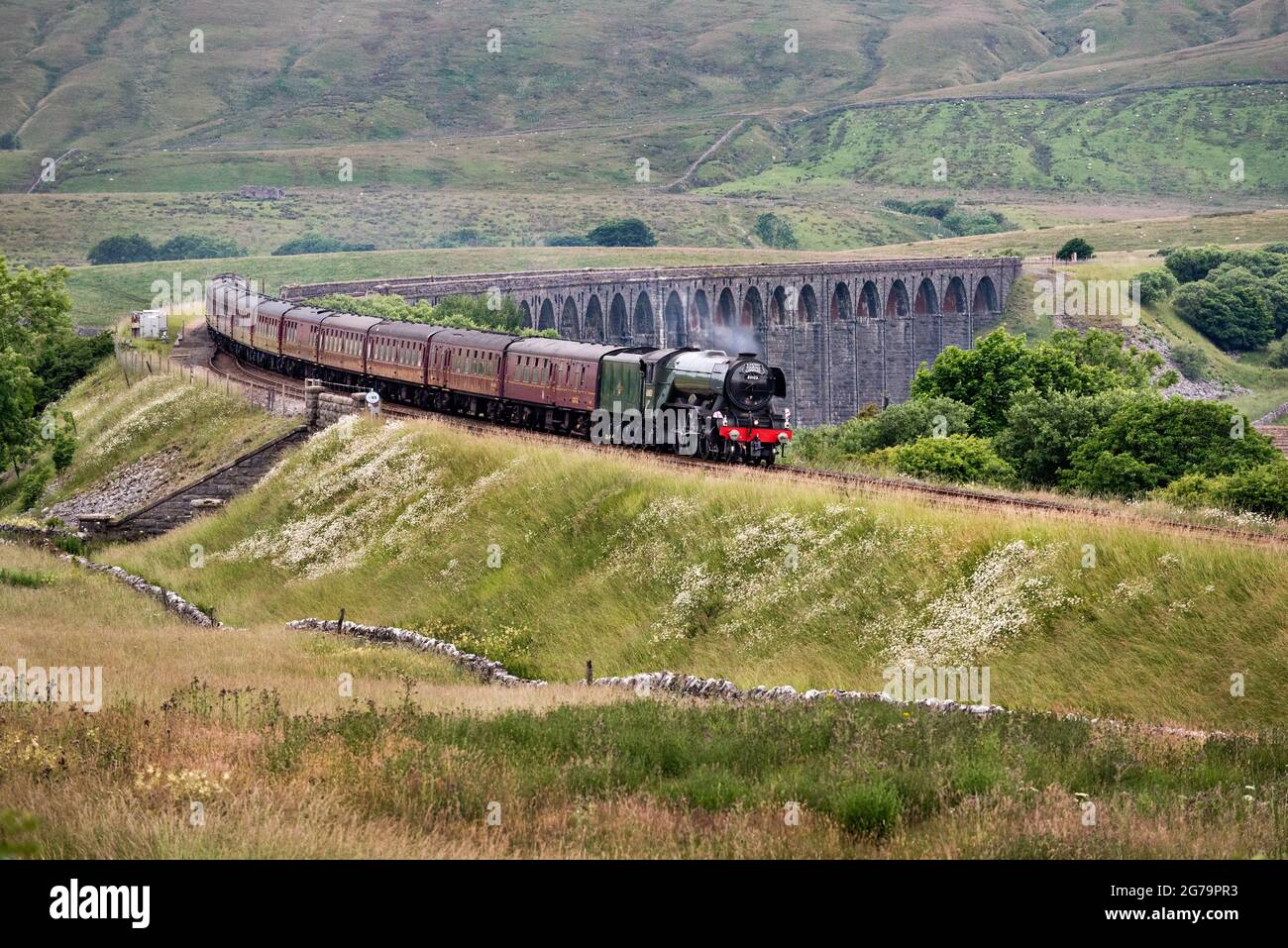The Flying Scotsman crosses Ribblehead Viaduct with 'The Waverley' steam special, 11th July 2021. Stock Photo