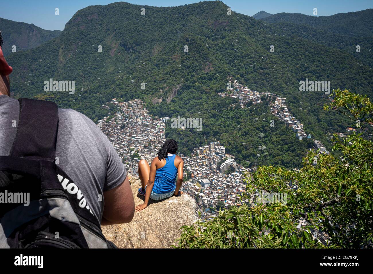 Elevated view from the cliff edge of two brothers hill (dos irmaos) with leica m10 over the Rocinha Favela - dense slum full of brick houses - in Rio de Janeiro, Brazil, from the top of Dois Irmaos Mountain. Stock Photo