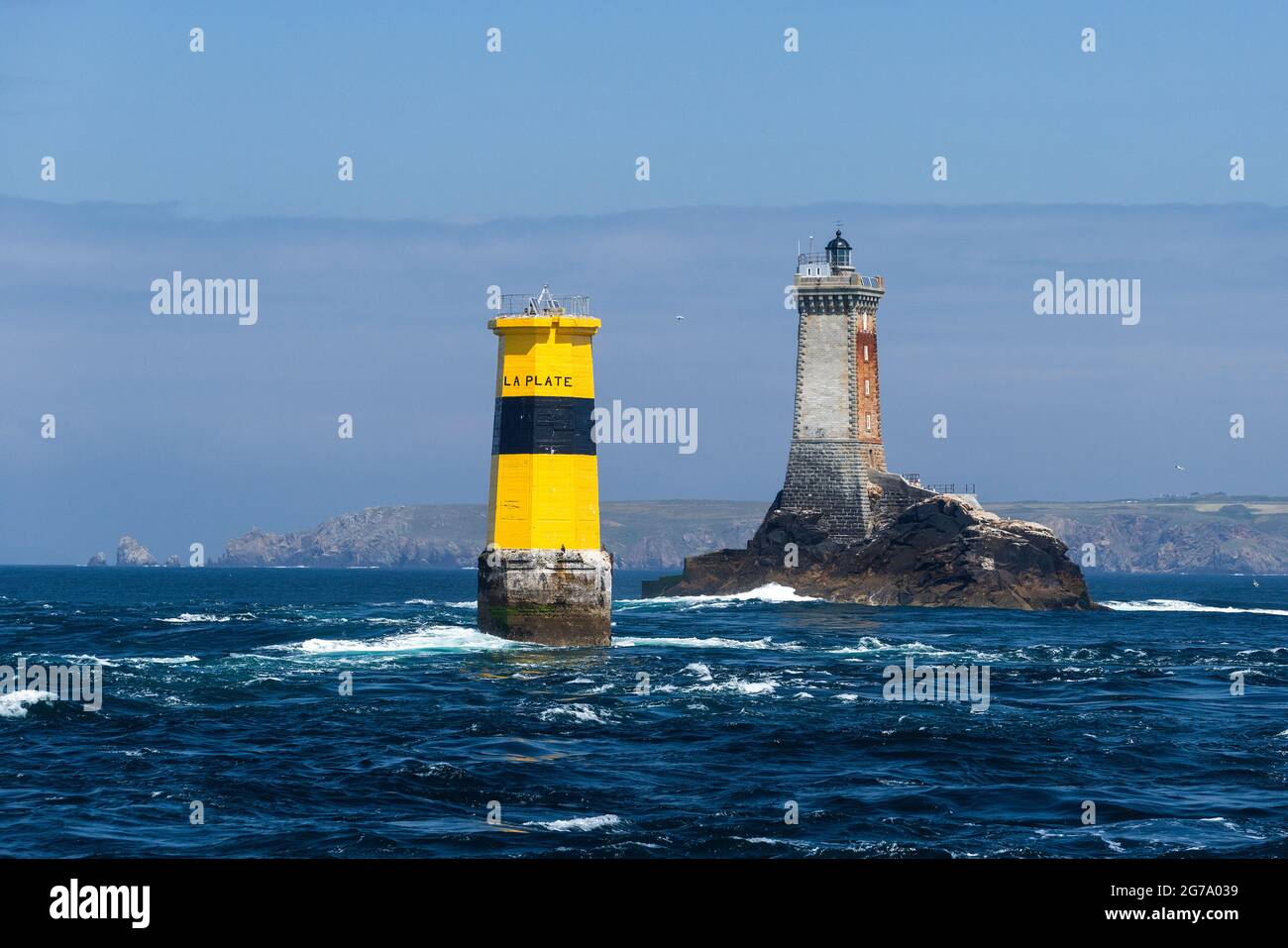 La Vieille lighthouse and Tourelle de la Plate, strait Raz de Sein, in the background the rocky coast of Pointe du Raz, France, Brittany, Finistère department Stock Photo