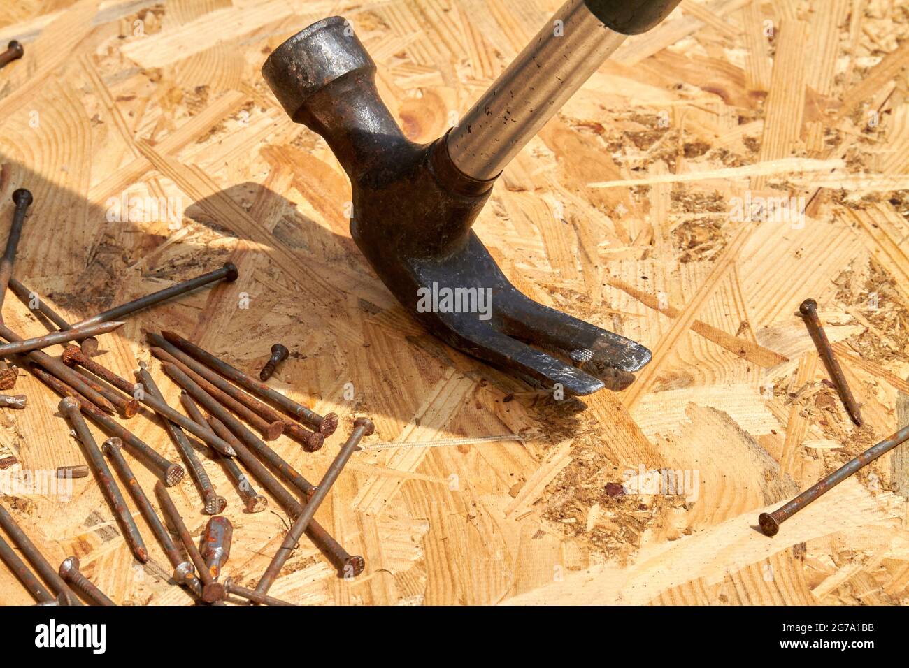 Closeup nails and metallic nails on plywood surface Stock Photo Alamy