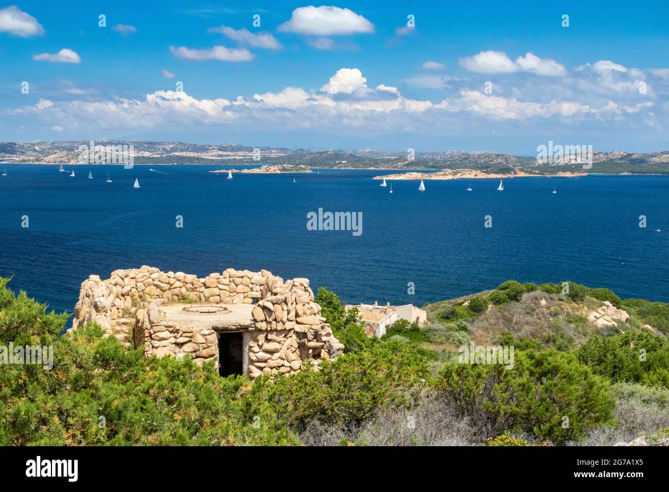 Coastline View of Northern Sardinia, Islands of La Maddalena & Isola Caprera With Yachts and Ruin of Batteria Battistoni Stock Photo