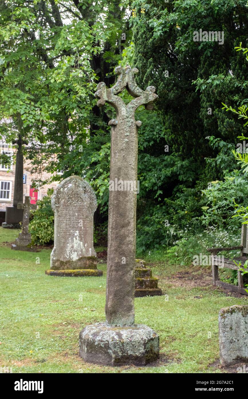 The medieval cross in the churchyard of St Mary the Virgin, Blanchland Stock Photo