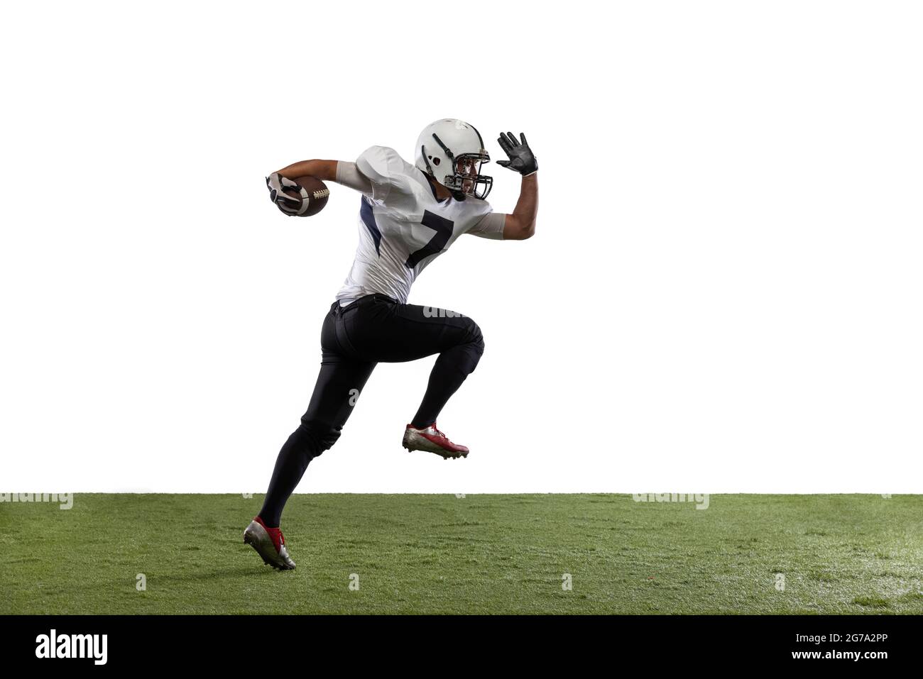 Portrait of American football player training, playing isolated on