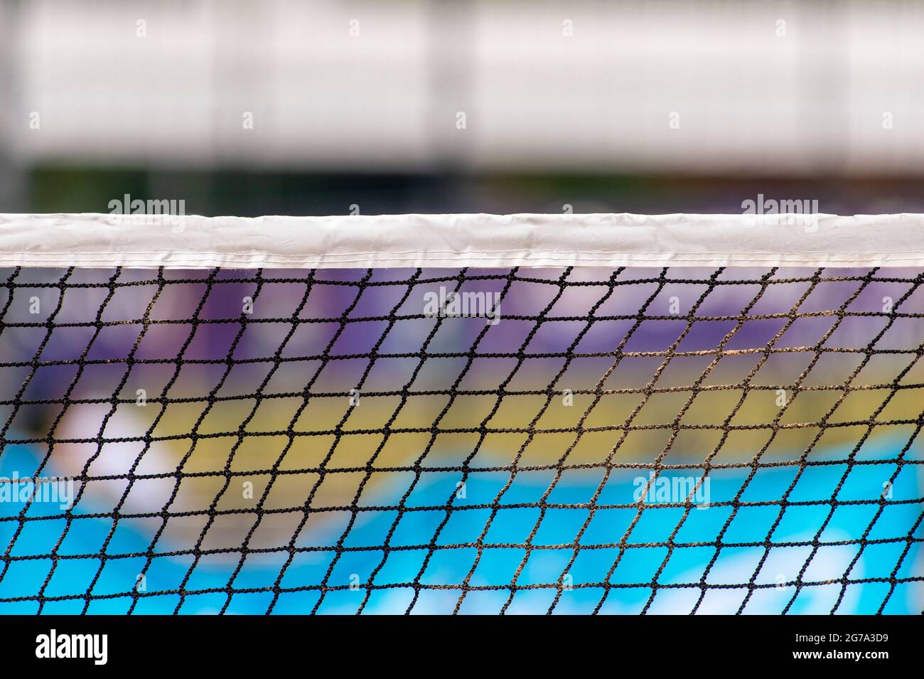 Beach volleyball and beach tennis net on colorful background. Summer
