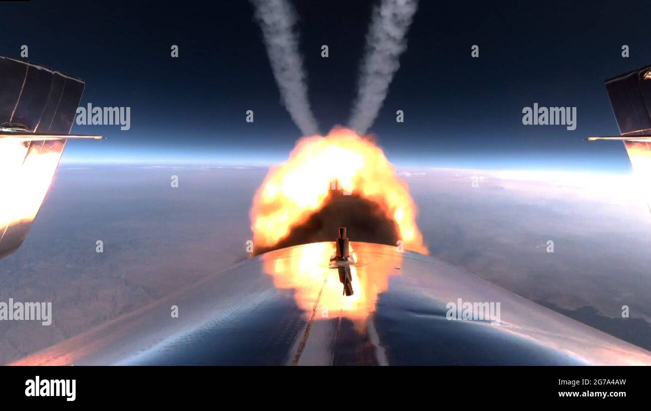 **Handout Image** Editorial Use Only** In this photo released by Virgin Galactic, VSS Unity rocket motor burn on #Unity22 on July 11, 2021. (Photo credit: Virgin Galactic) *** Please note: Fees charged by the agency are for the agency's services only, and do not, nor are they intended to, convey to the user any ownership of Copyright or License in the material. The agency does not claim any ownership including but not limited to Copyright or License in the attached material. By publishing this material you expressly agree to indemnify and to hold the agency and its directors, shareholders and Stock Photo