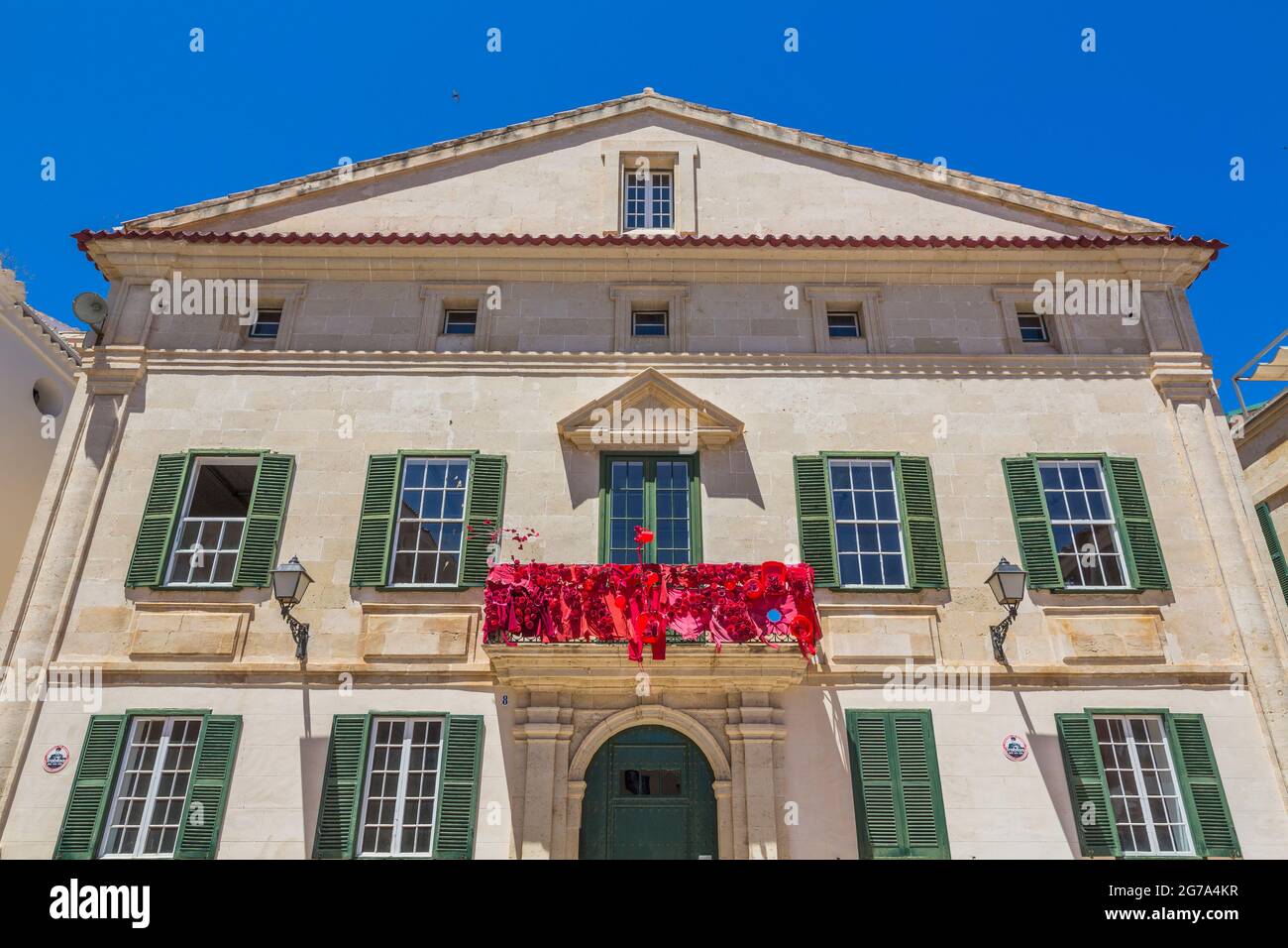 Red decorated balcony, Can Mercadal, municipal library, Biblioteca Central Insular, Placa de la Conquesta, Mahon, Mao, Menorca, Spain, Europe Stock Photo