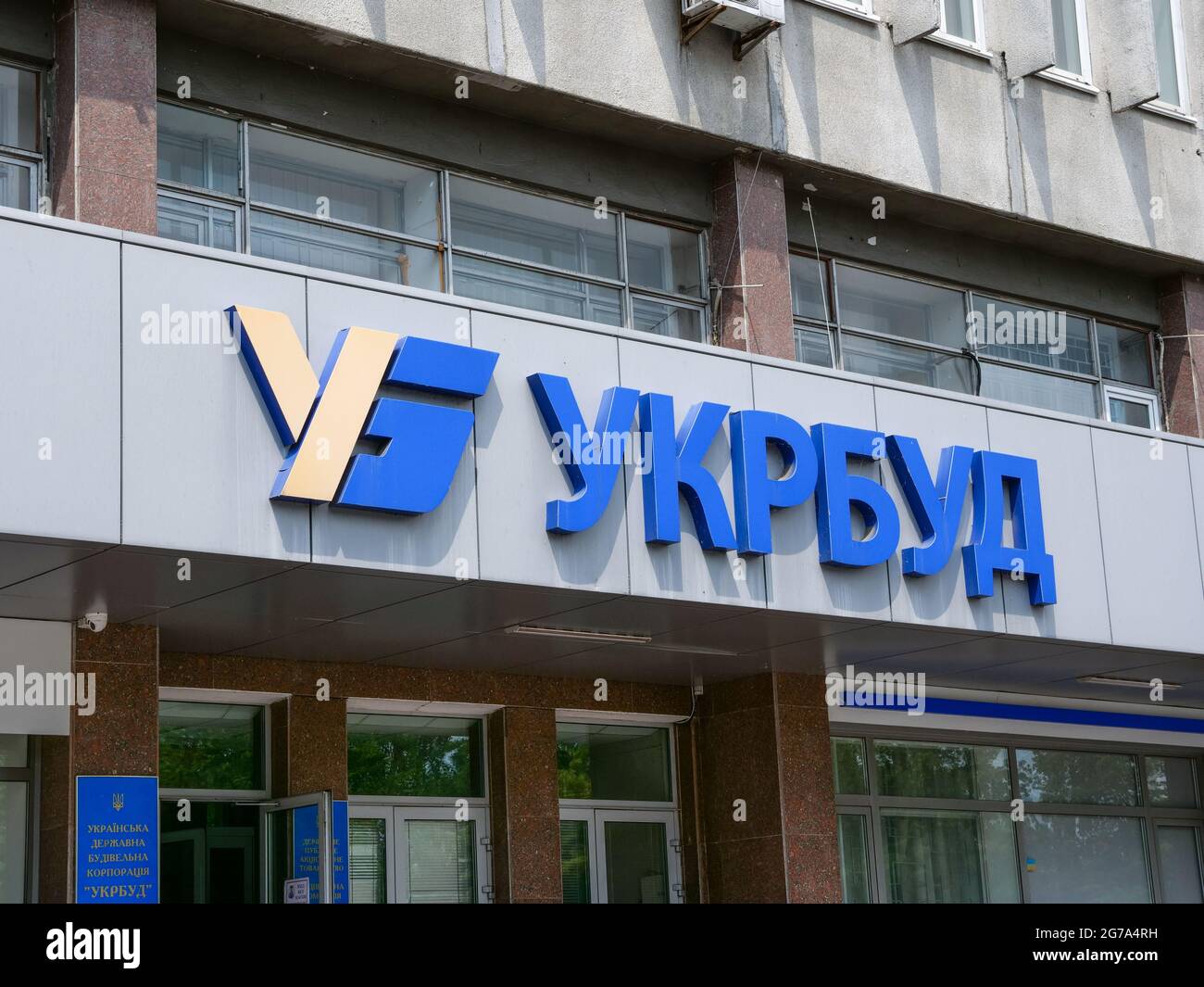 KYIV, UKRAINE - July 04, 2021. Ukrbud construction company logo on the building. Stock Photo
