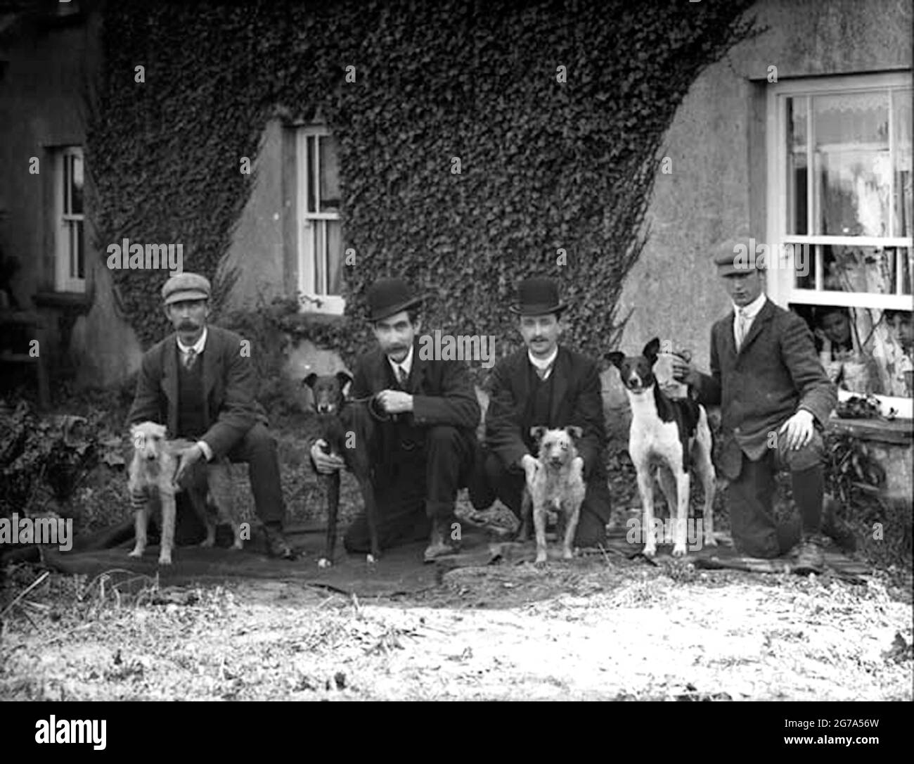 Quirky vintage photograph posing the question Do dog owners grow to look like their dog? Stock Photo