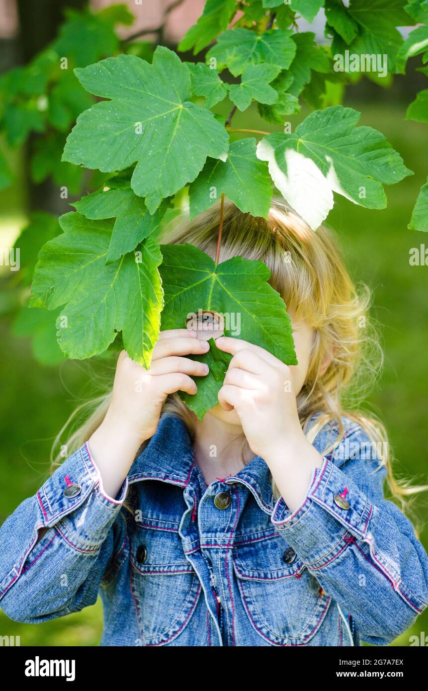 girl with green leaves in eyes Stock Photo - Alamy