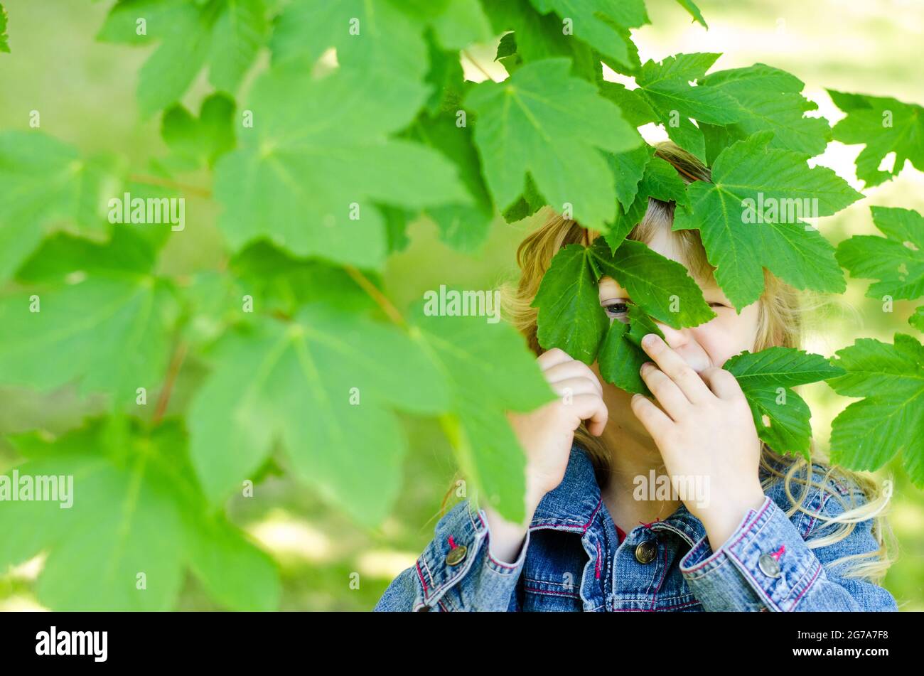 girl with green leaves in eyes Stock Photo - Alamy