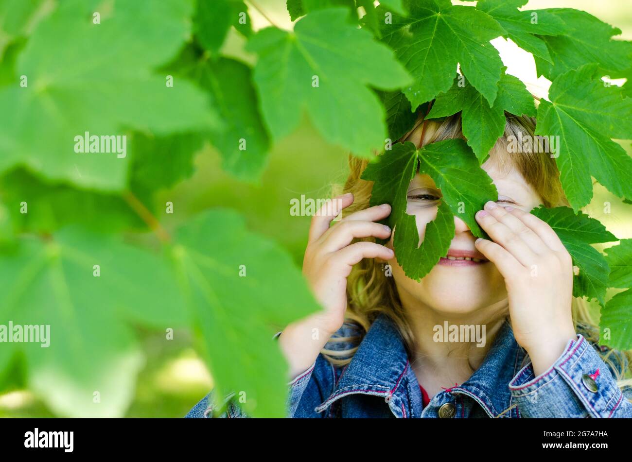 girl with green leaves in eyes Stock Photo - Alamy