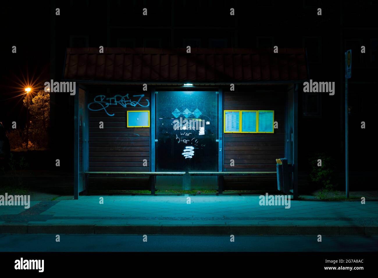 At night on the street,  Bus stop at night without people in the small town of Luckenwalde in Germany Stock Photo