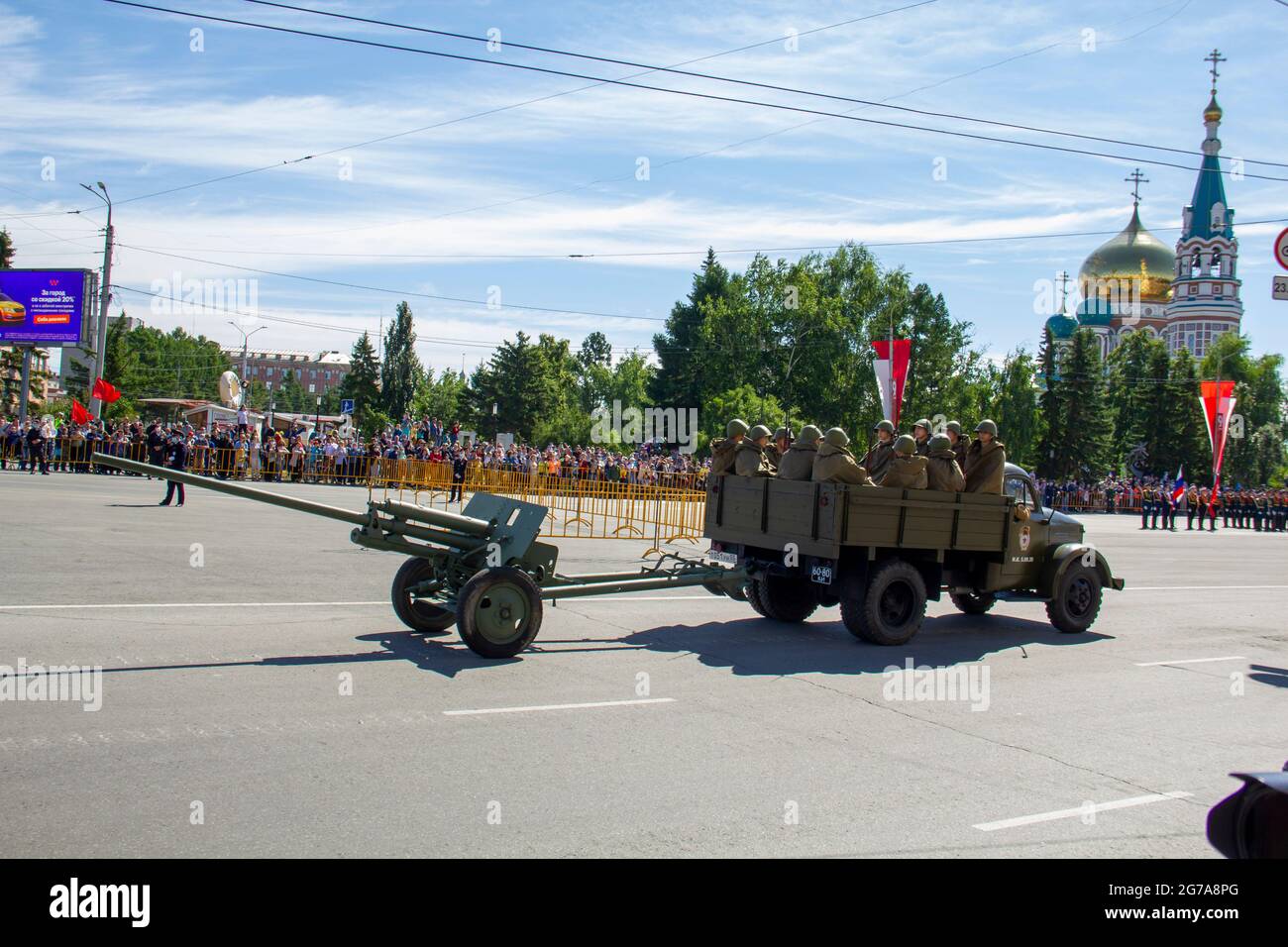 Omsk, Russia. 24 June, 2020. GAZ-51 military vehicle with soldiers and a light cannon are finishing moving in a festive column. Parade of military equ Stock Photo