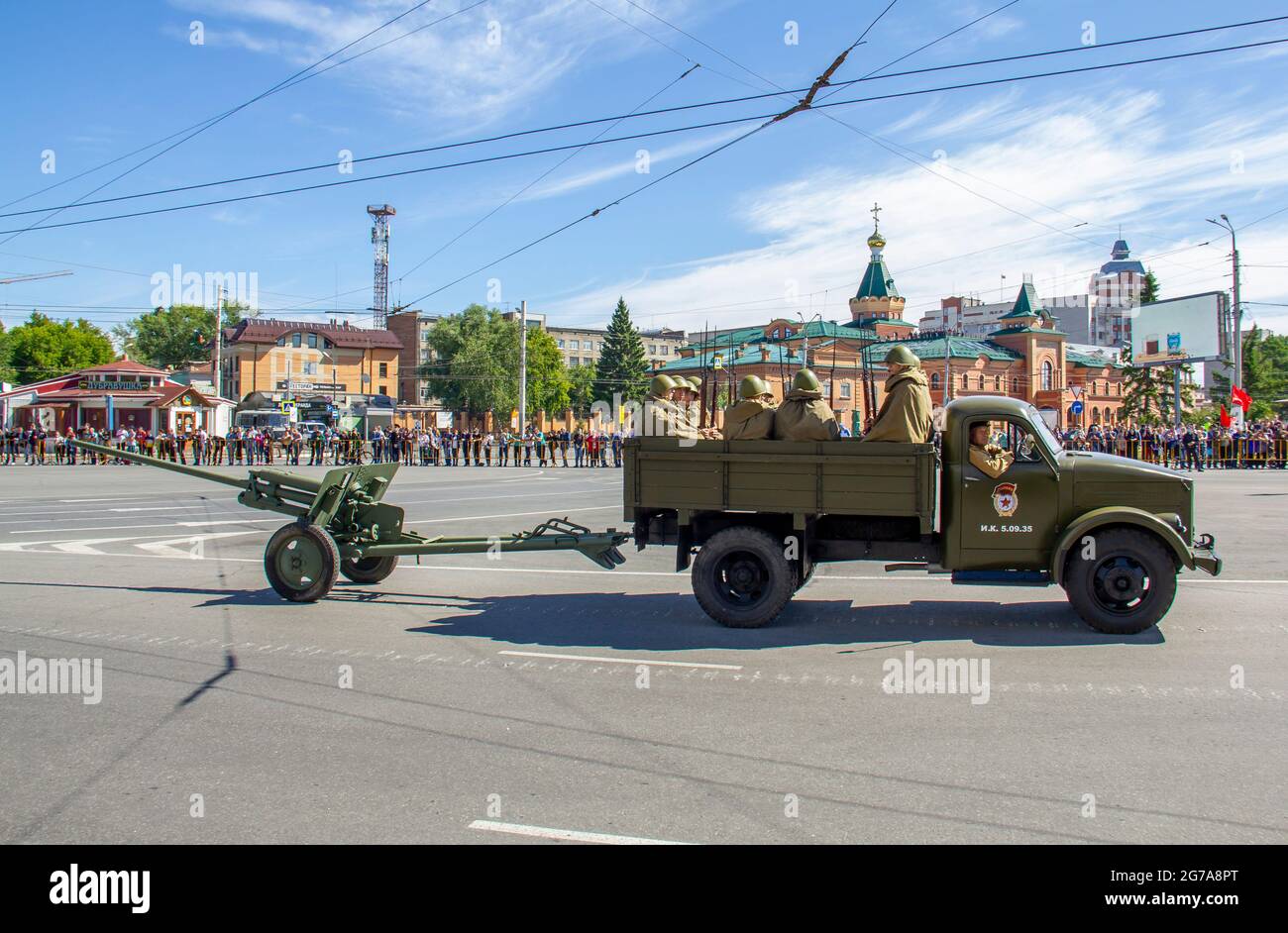 Omsk, Russia. 24 June, 2020. GAZ-51 military vehicle with soldiers and a light cannon are moving in a festive column. Parade of military equipment in Stock Photo