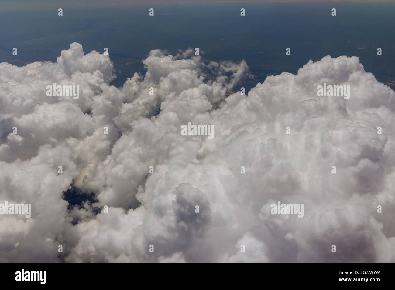 Aircraft flying over city Denver district during landing view from airplane window beautiful sky with clouds Stock Photo