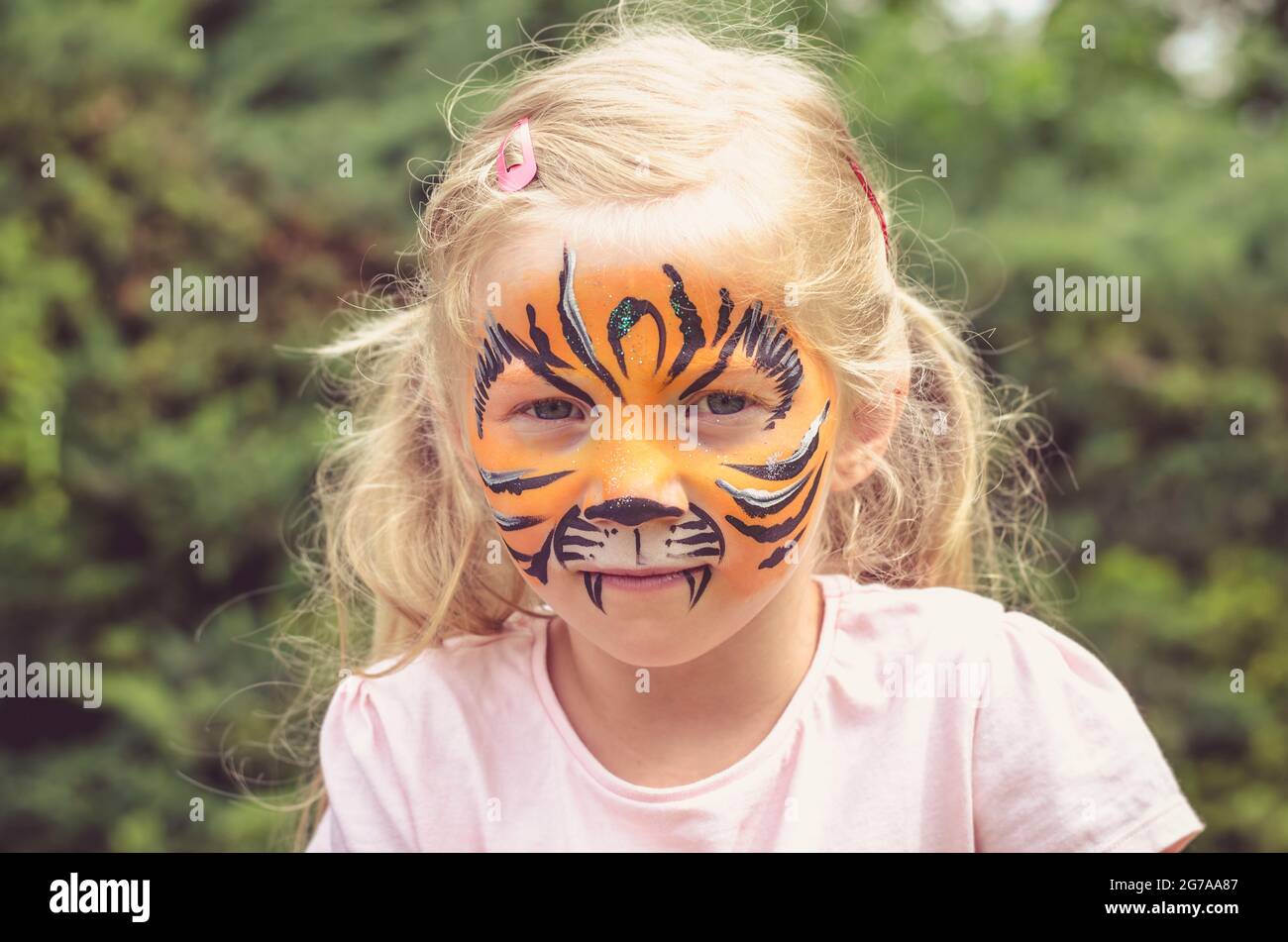 Cute Makeup Little Tiger. Girl Getting Face Painting Outdoors