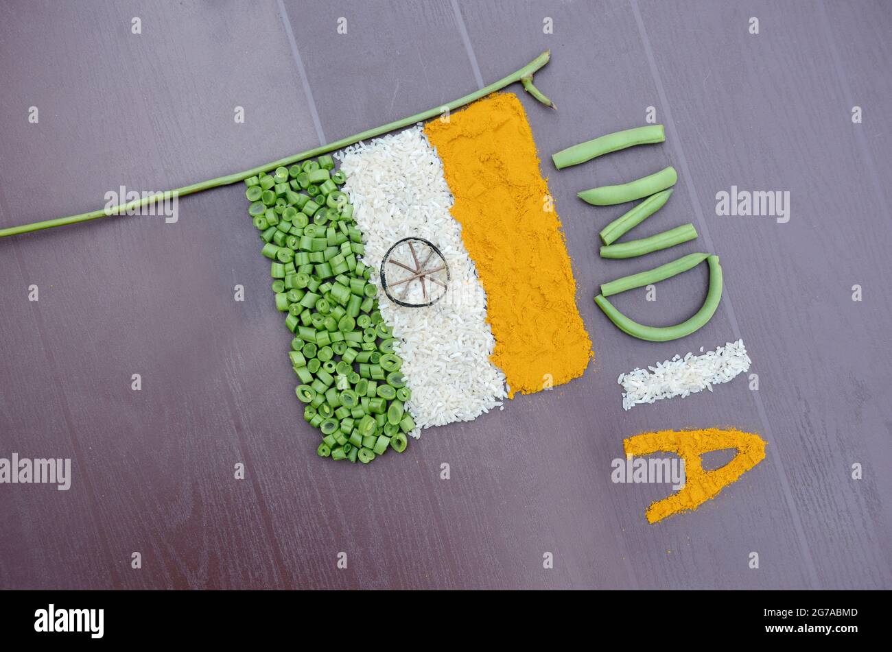 closeup orange turmeric,white rice , green beans vegetable with writing