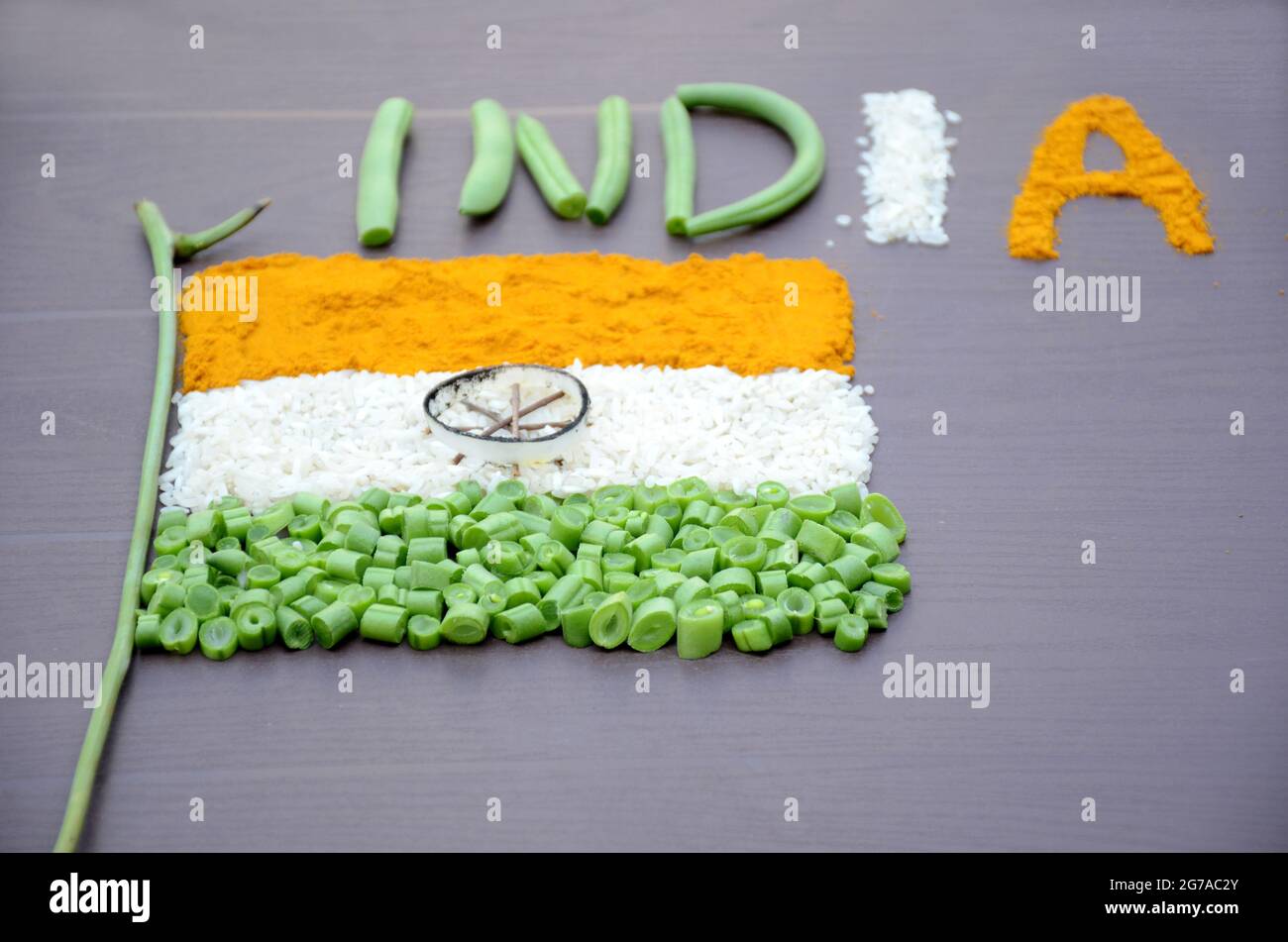 closeup orange turmeric,white rice , green beans vegetable with writing