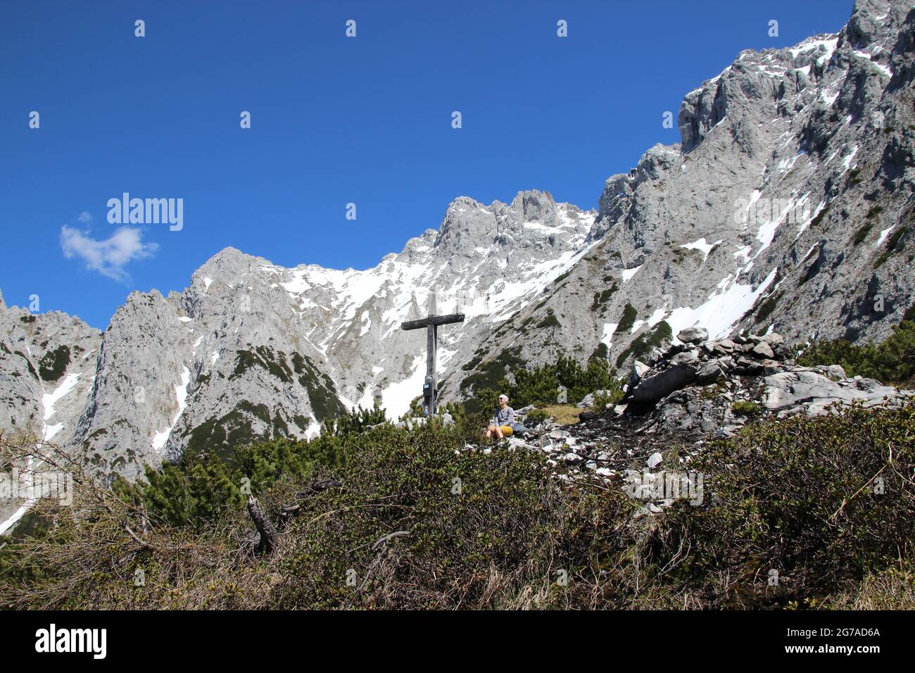 Cross on Gamseck above the Mittenwalder Hut, memorial cross in spring in front of blue sky, woken mood, atmospheric, Mittenwald, Karwendel, Karwendel Mountains, spring, Stock Photo