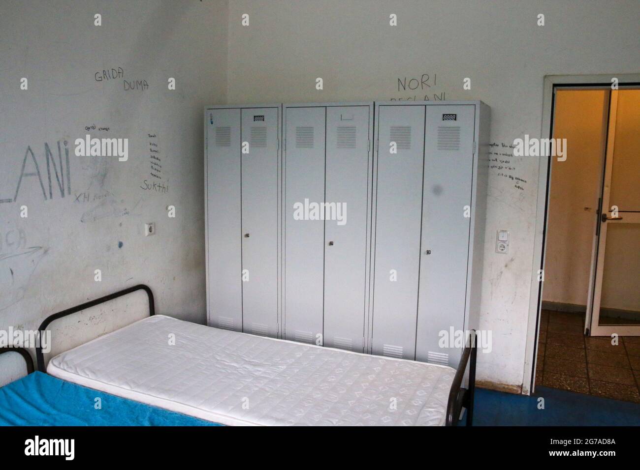 Empty beds and cupboards in an asylum seekers home. Stock Photo