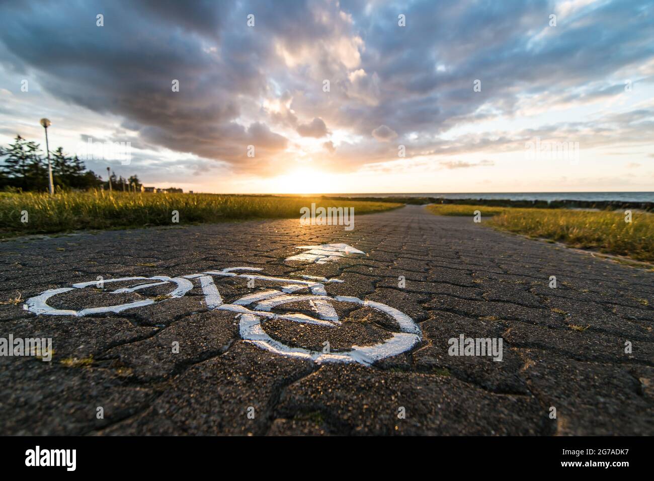Bicycle path at sunset in autumn in Schoenberg, Kiel, Germany. Stock Photo