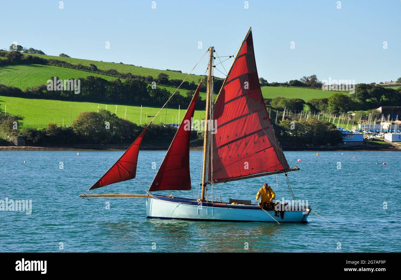 Falmouth Work Boat designed for dredging the native oysters in the Fal river.they have a gaff cutter rig and a long keel hull.Cornwall,England,UK Stock Photo