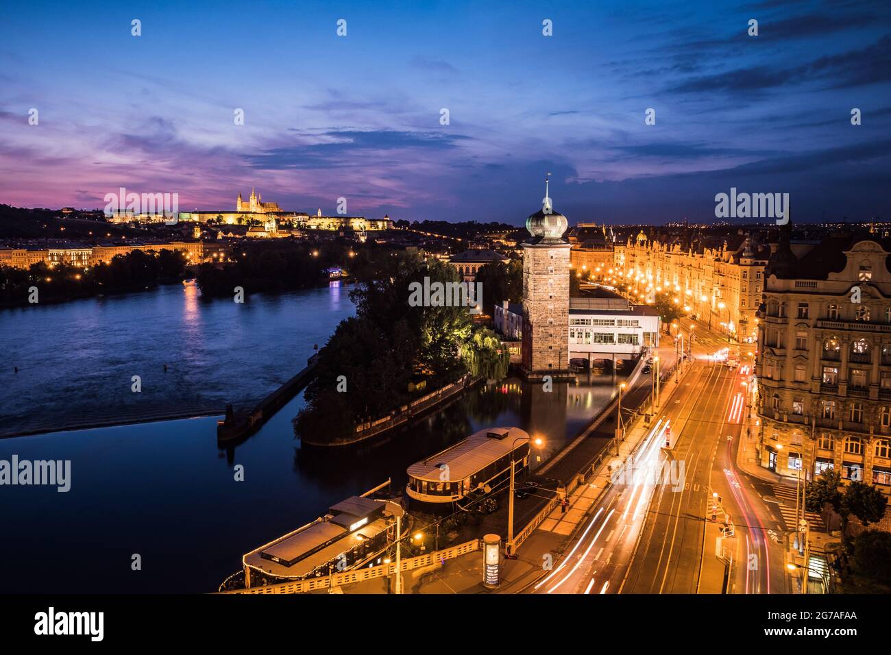 Prague, Czech Republic - July 2 2021: Prague Cityscape at Night with River Vltava, Masaryk Embankment and Manes Gallery. Stock Photo