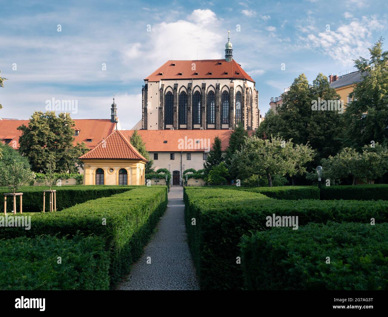 Franciscan Garden or Frantiskanska Zahrada in Prague, Czech Republic with Church of Our Lady of the Snows, also called Kostel Panny Marie Snezne Stock Photo